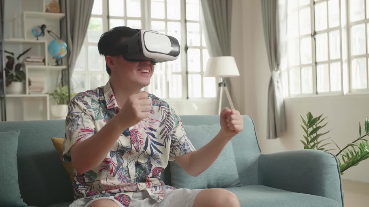 Man wearing VR headset, enjoying a game at home