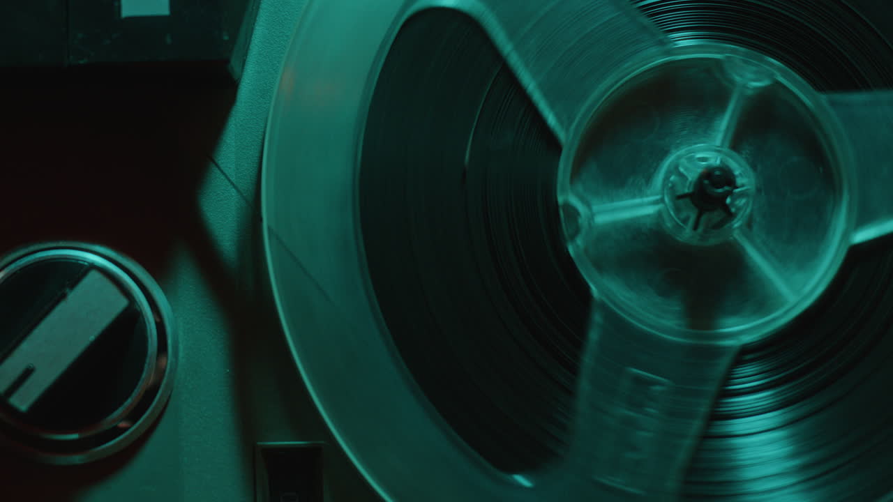 Spinning Spool of Retro Open-Reel Tape Recorder