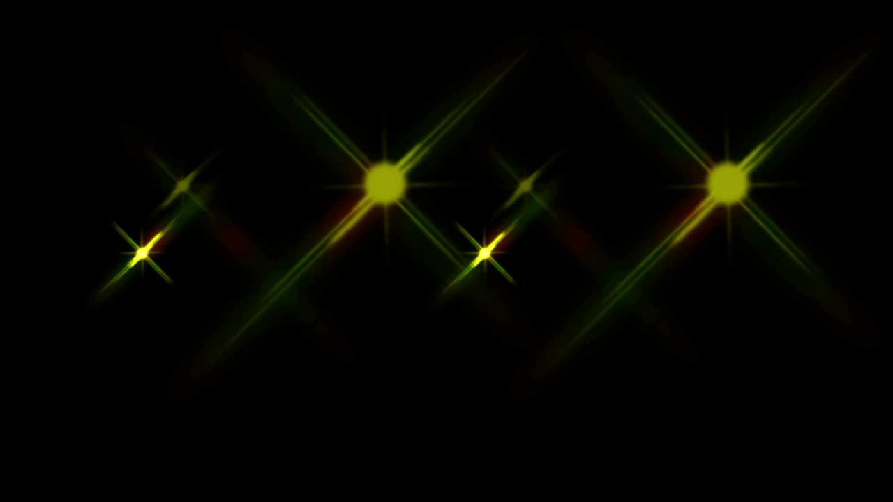 Animation yellow light sparkles on black background.