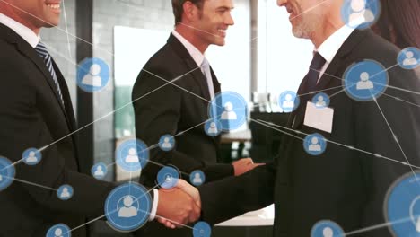 Animation-of-network-of-people-icons-over-smiling-diverse-businessmen-shaking-hands