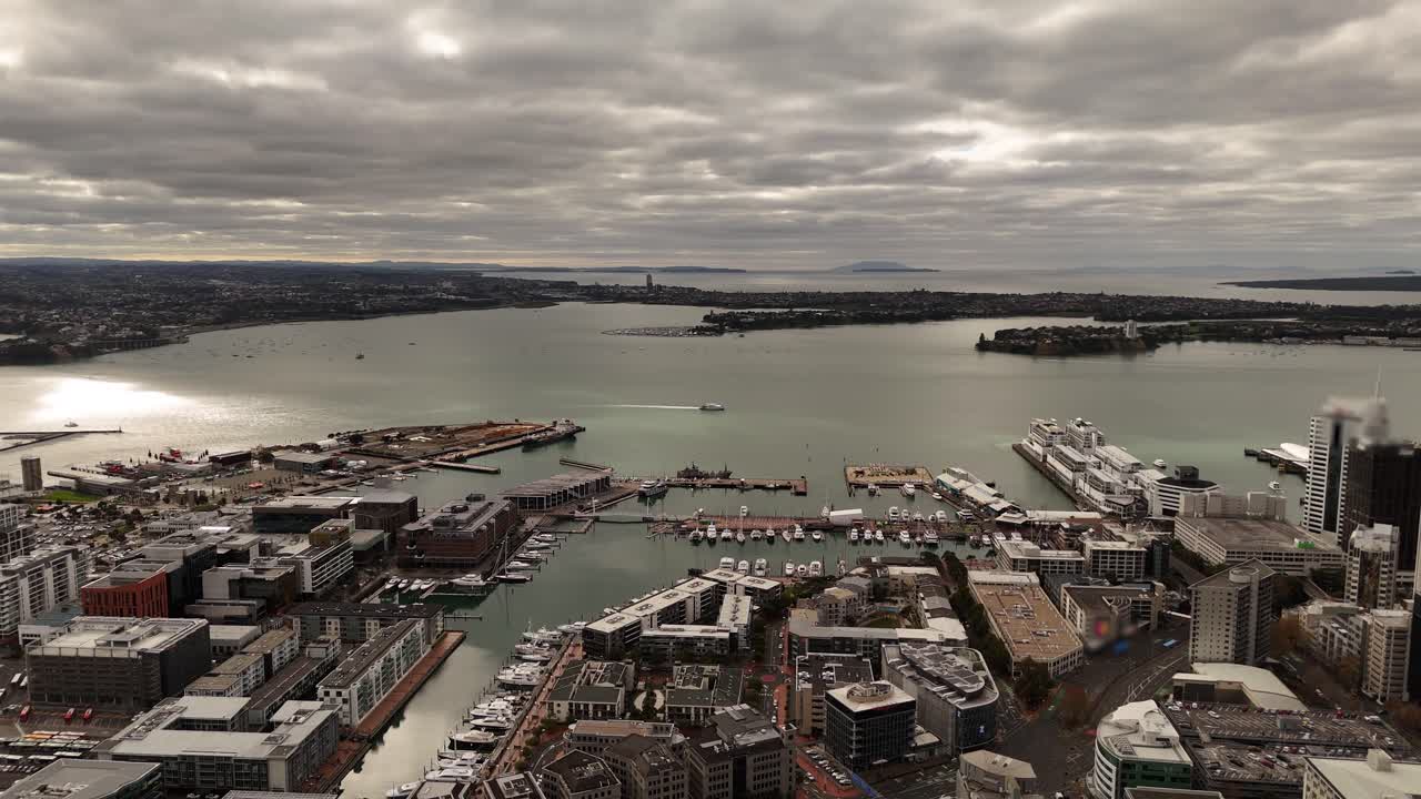 Auckland CBD, Viaduct Harbour, city port, Waitemata Harbour with boats and ferries, New Zealand. Aerial drone panoramic view