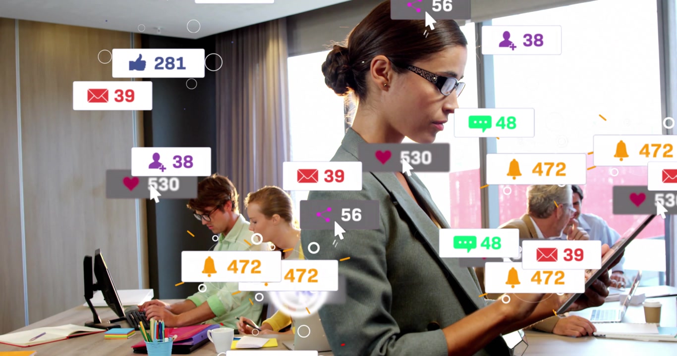 Businesswoman tapping tablet and displaying notification icons showing engagement in office meeting