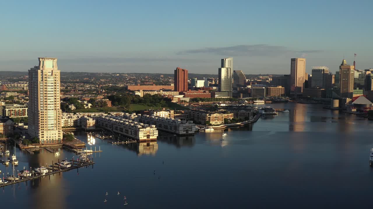 Slow settling tilt up over the Patapsco River in Baltimore Maryland at golden hour sunrise