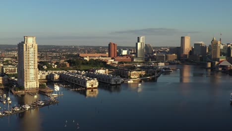 slow settling tilt up over the patapsco river in baltimore maryland at golden hour sunrise