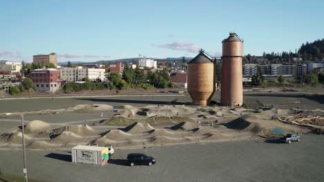 mountain bikers on dirt pump track near kulshan trackside in bellingham downtown, washington