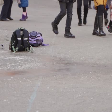 close-up. happy kids slide on the ice. frosty winter day. winter fun in the schoolyard