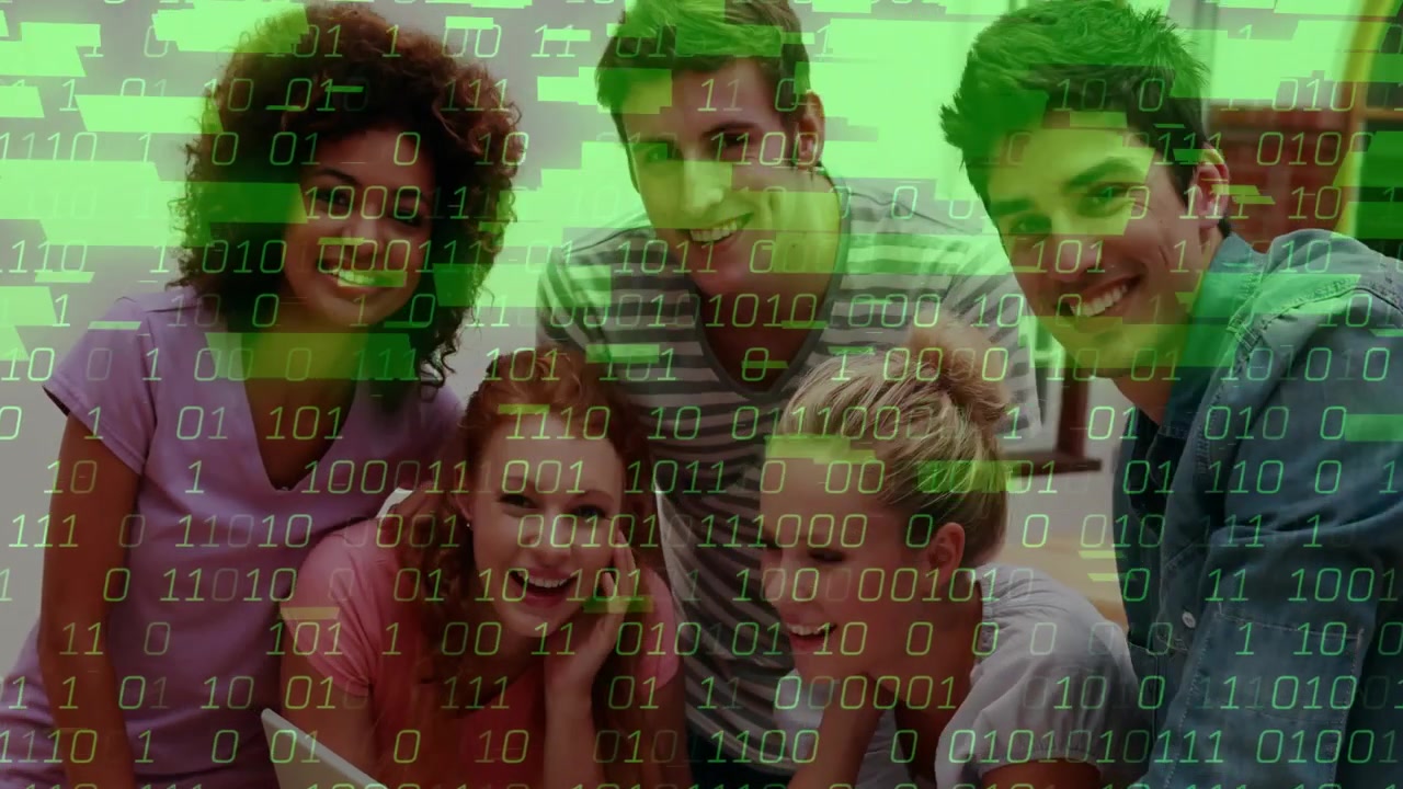 Five adults leaning toward laptop pointing at screen causing green binary overlay for data analysis