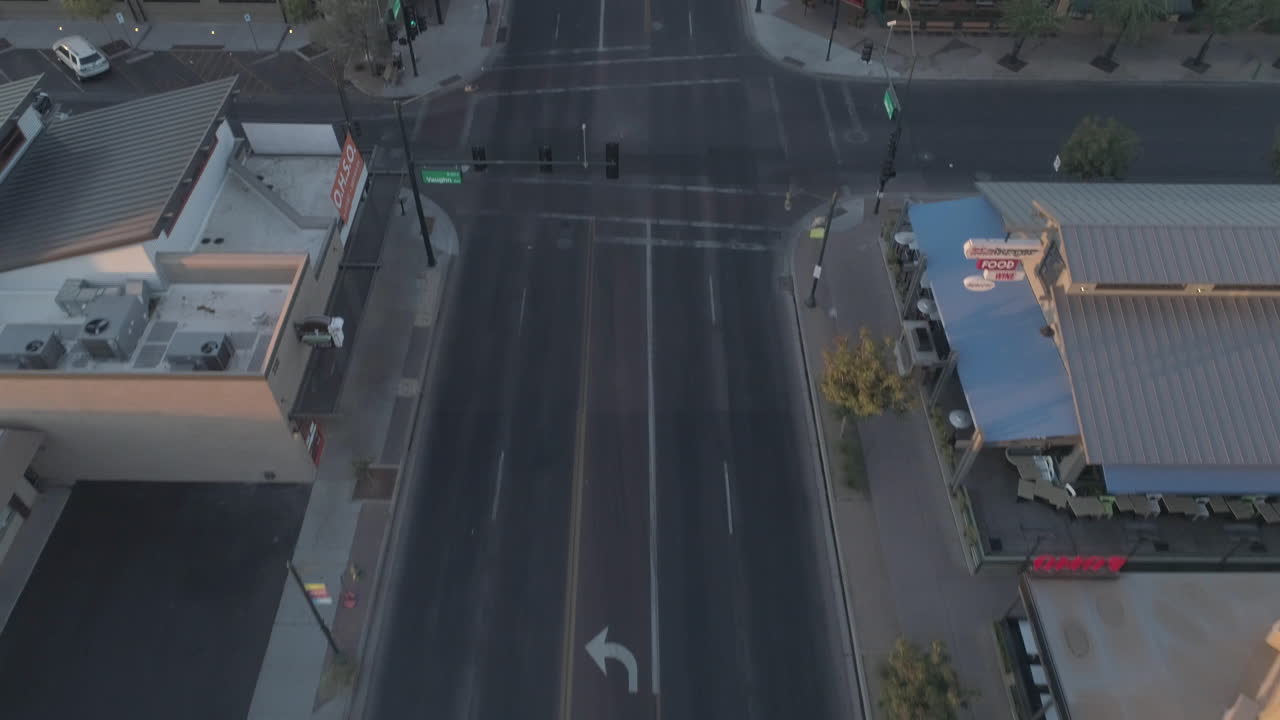 AERIAL - Tilt Up Drone Shot of Downtown's Main Road