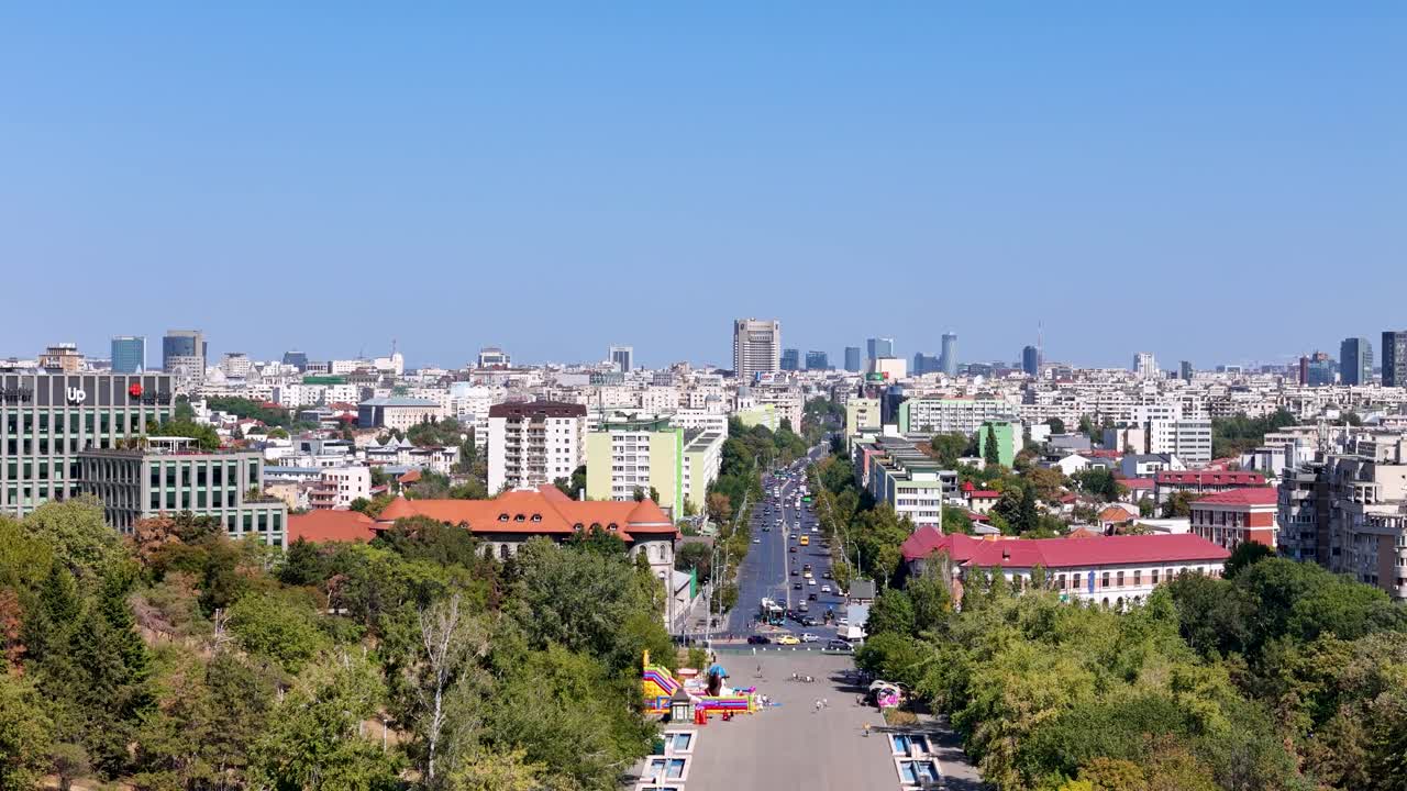 Aerial View of Tineretului Park Entrance with Bucharest's Cityscape and Traffic in the Background, Romania