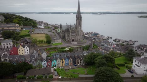 st colman’s cathedral cobh aerial view deck of cards colourful houses