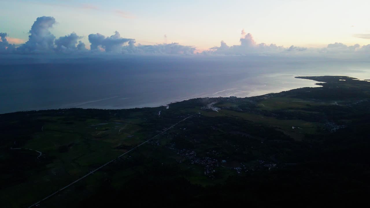 Dramatic coastline horizon and cloudscape during twilight at island province San Andres, Catanduanes, Philippines - aerial drone shot