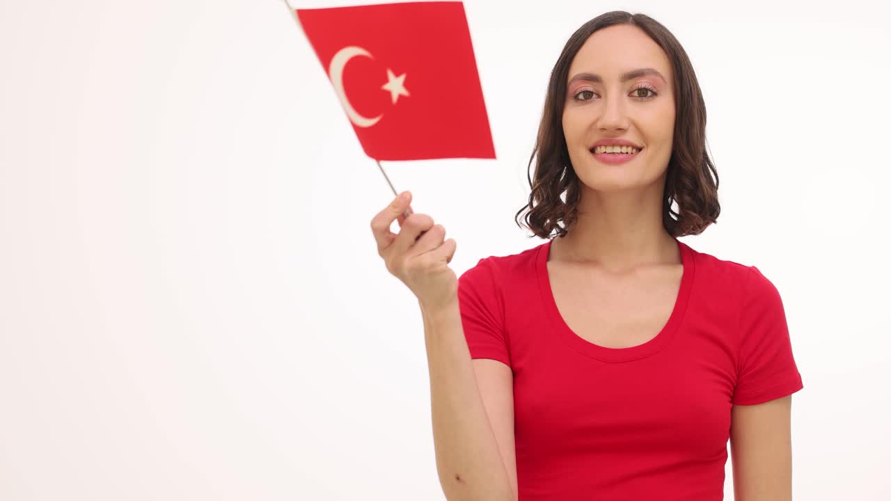 Woman holding the flag of Turkey