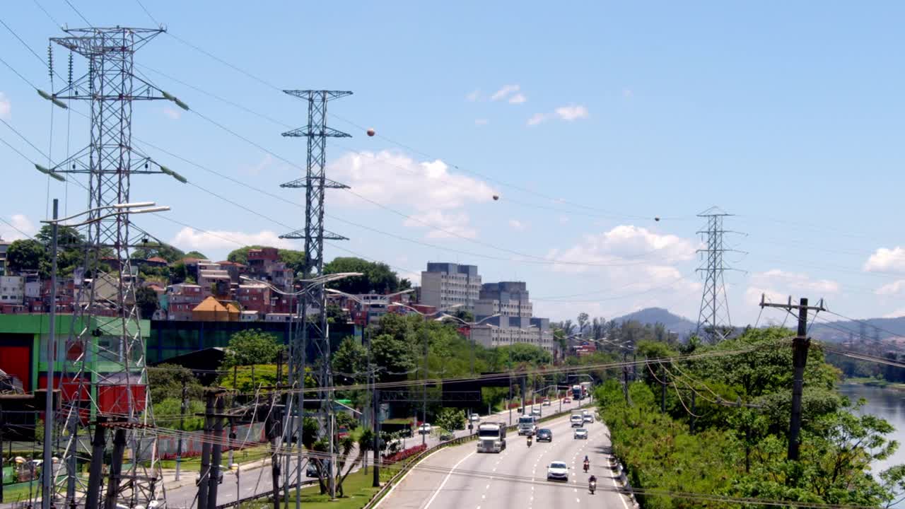 Busy Highway Scene in a Brazilian City with Power Lines and Residential Areas