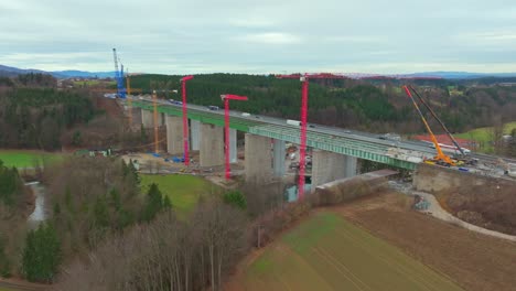 Traffic-Across-The-Bridge-Next-To-Highway-Bridge-Under-Construction