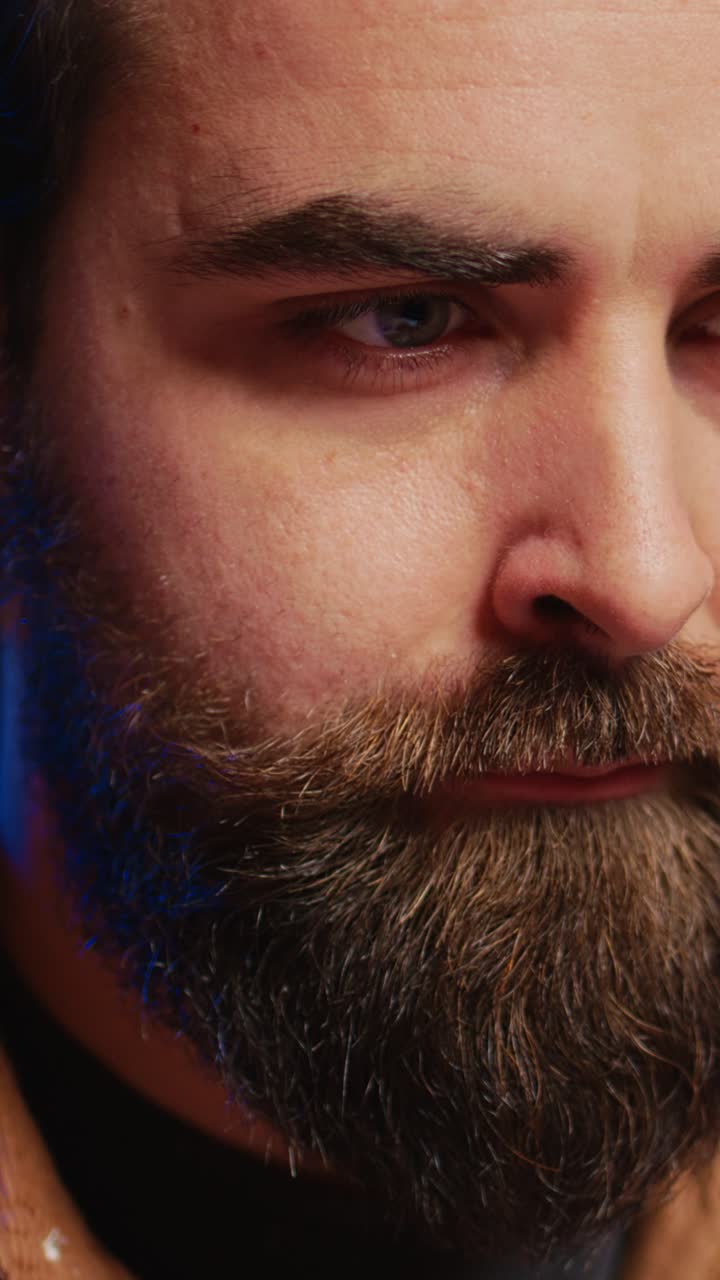 Intense Close-Up of a Bearded Man's Face