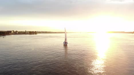 aerial tracking shot of a traditional sailing boat on the upper columbia river