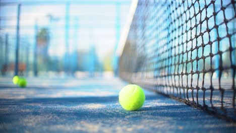 padel court, ball, net and empty field close-up view in slow motion with depth of field