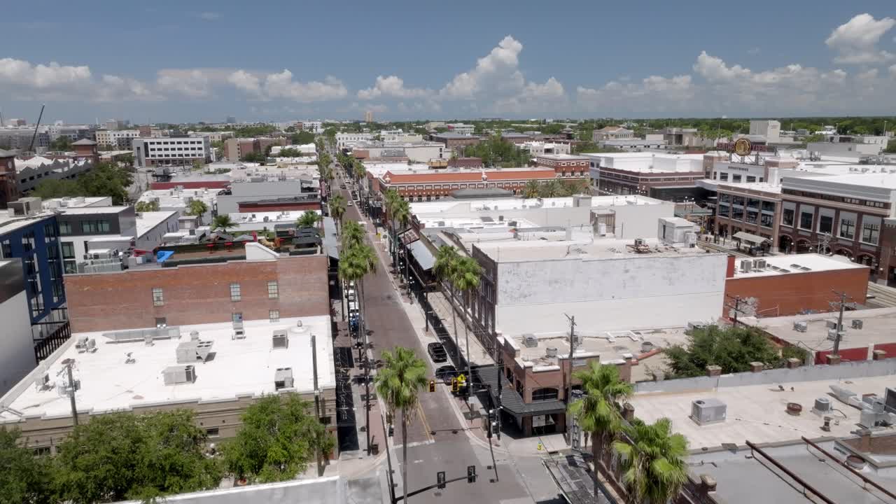 Ybor City neighborhood in Tampa, Florida with drone video moving up wide shot