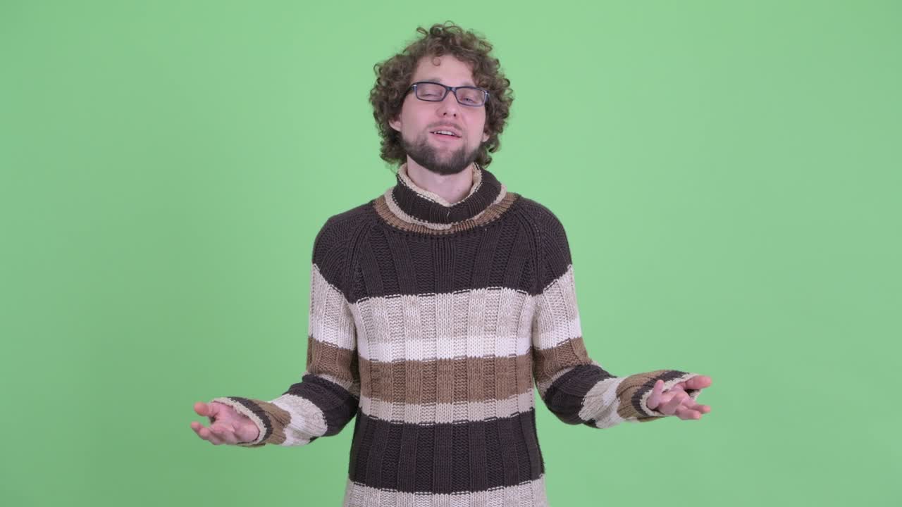 Young handsome bearded man with curly hair