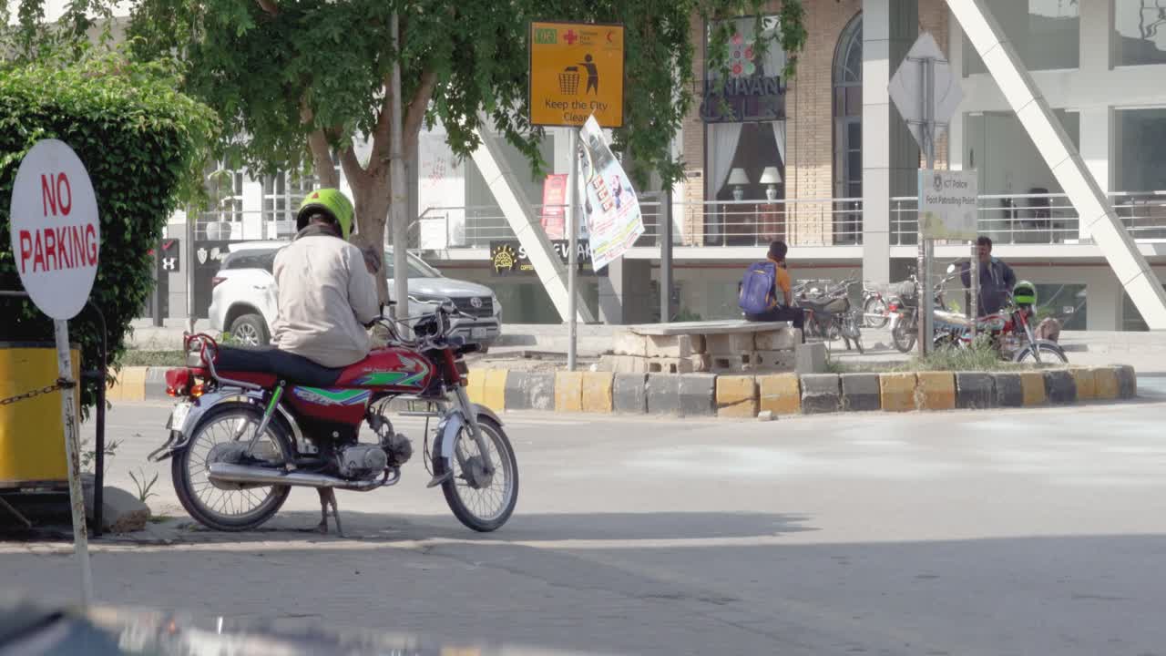 People on Motorcycles in a City Street