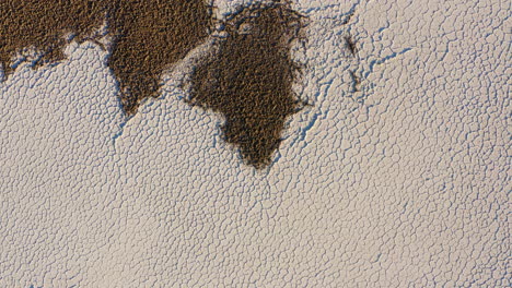 aerial top down view over dry salt flats at badwater basin of death valley national park