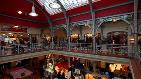bustling indoor market in camden town with vibrant stalls and shoppers, london. tilt-down shot