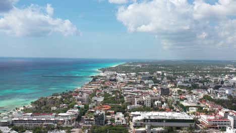 caribbean city aerial shot, high altitude lateral tracking heading inland