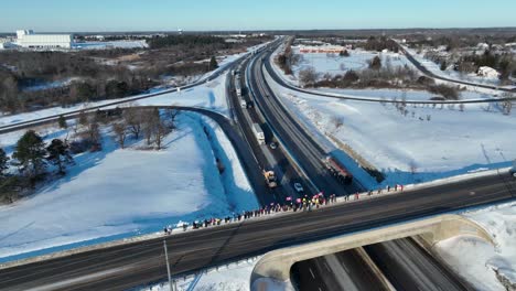 Aerial-Freedom-convoy-2022-leaving-Kingston-Ontario-Canada-with-people-supporting