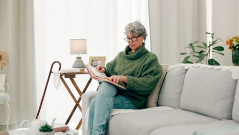 Senior-woman,-sofa-and-reading-book-in-living-room