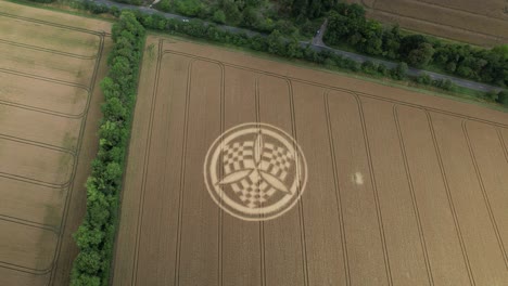 Aerial-view-rising-over-idyllic-South-Wonston-2023-crop-circle-next-to-Hampshire-farmland-road