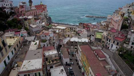 tilt-up reveal aerial of town buildings on amalfi coast, italy