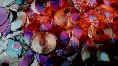 compact discs melt under the powerful hot flame of fire