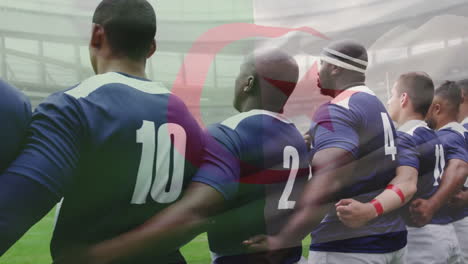 animation of flag of algeria over diverse male rugby players at anthem at stadium