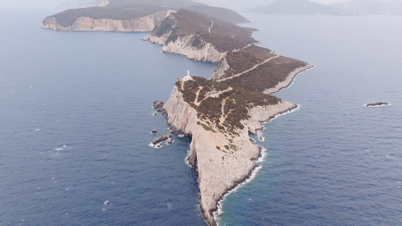 Aerial View of a Lighthouse on a Rocky Cape