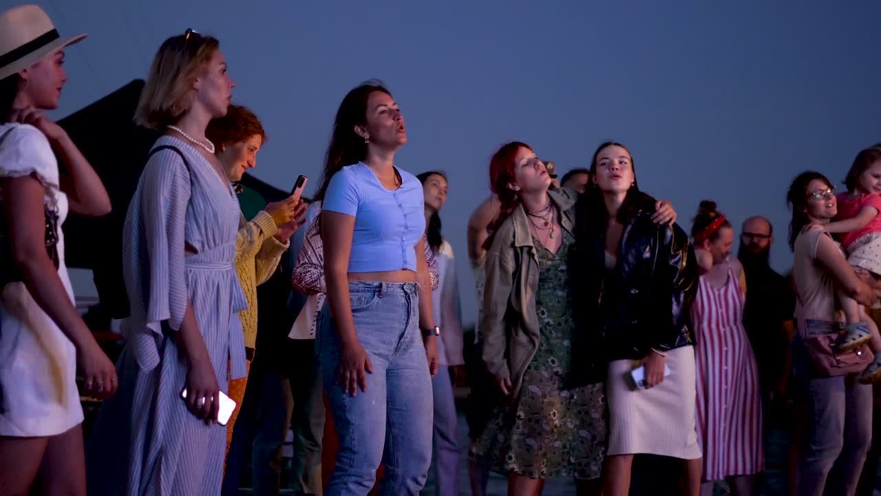 Girls dancing in front of the stage. Music festival in Lithuania.