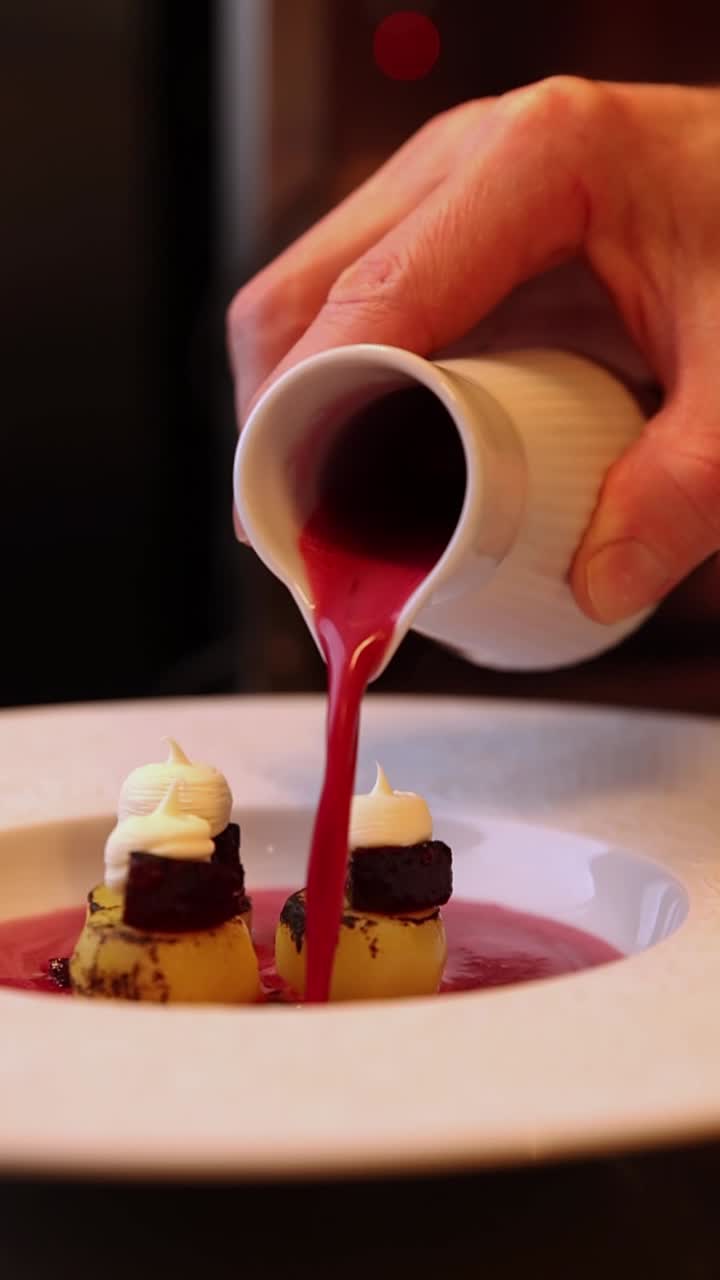 Pouring Sauce on a Gourmet Dish