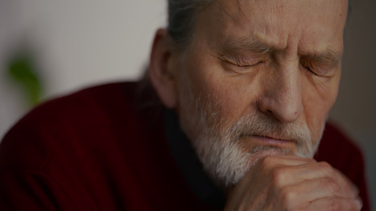 Close-up of a Pensive Elderly Man with a Sad Expression