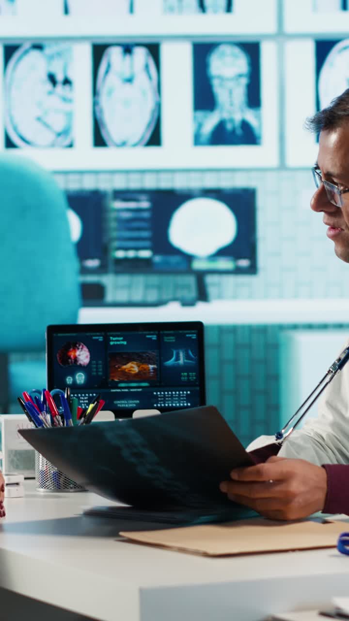 Two Doctors Discussing X-Ray Scans in a Medical Office