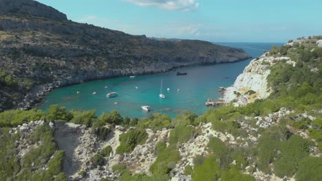 aerial above cliffs to beautiful anthony quinn beach on rhodes island