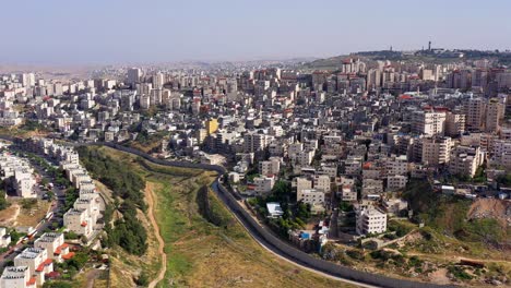 aerial view of a city divided by a separation wall