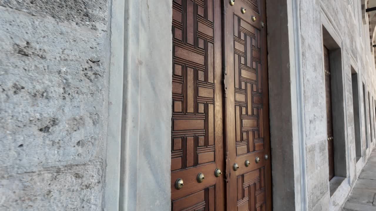 Ornate Wooden Door of a Historical Mosque