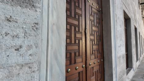 ornate wooden door of a historical mosque
