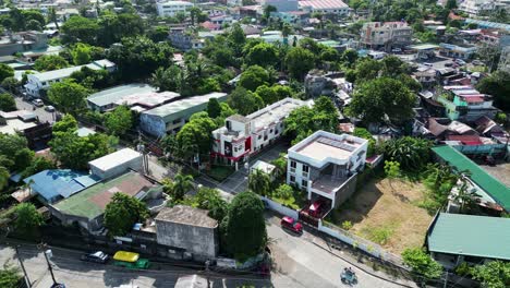 Aerial-orbit-shot-of-residential-area-in-a-provincial-town-with-inns,-hostels,-and-townhouses