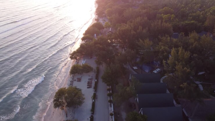 Aerial View of Tropical Island Coastline at Sunset