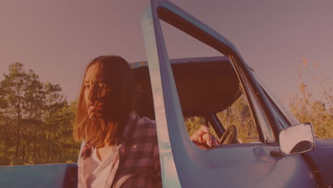 Caucasian-woman-getting-out-of-the-car-and-opening-the-hood-on-the-street