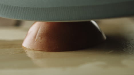 slow-motion of tomato being sliced