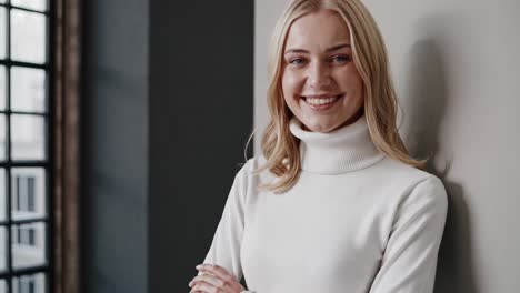 smiling woman in a white turtleneck