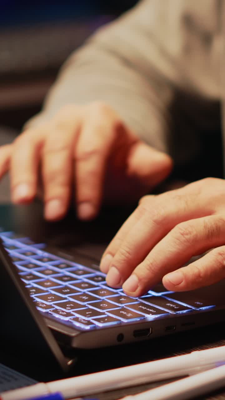 Vertical video: Male cyber criminal hacking password to break server security