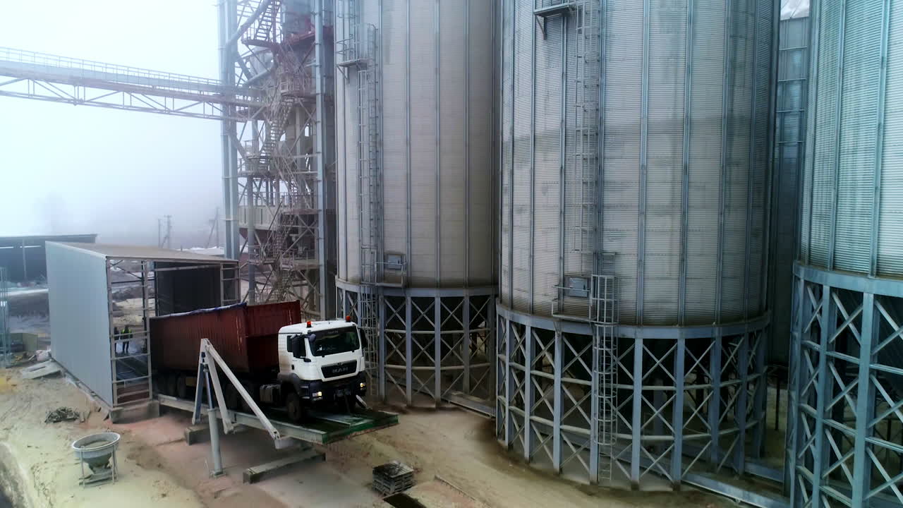 Truck Loading/Unloading at Grain Silo Facility