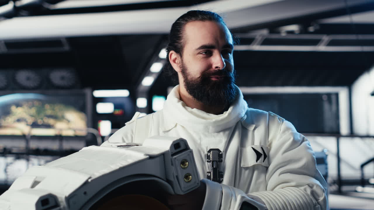 Portrait of smiling astronaut holding protection helmet